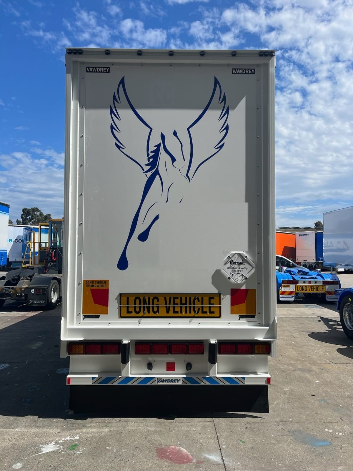 Rear doors of a Flying Horse trailer with the blue Pegasus logo